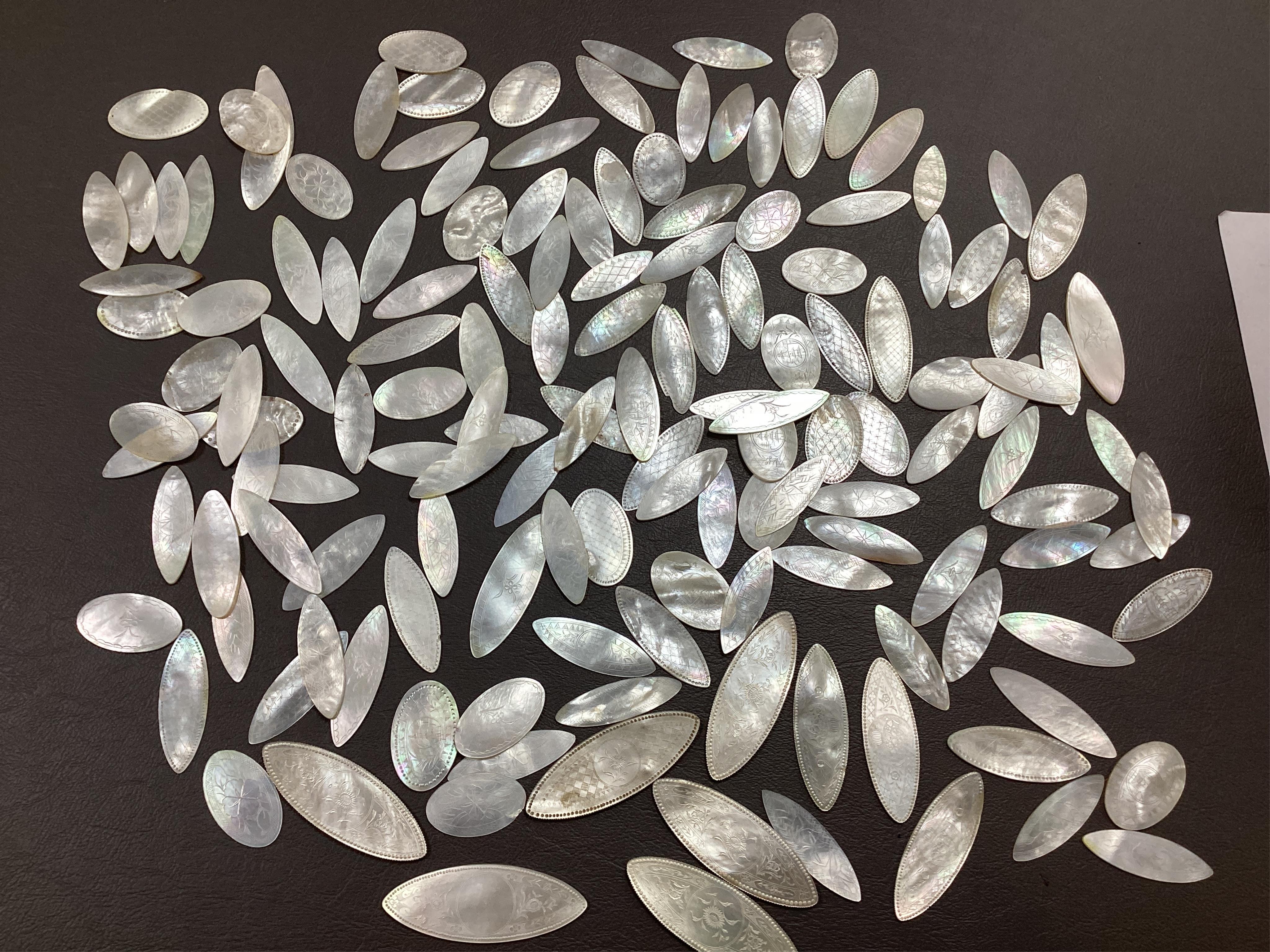 Two Chinese gilt decorated black lacquer games boxes, containing numerous mother-of-pearl counters, 19th century